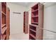Spacious walk-in closet with custom shelving and ample storage space at 16746 Amberside E Rd, Cornelius, NC 28031