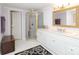 Bathroom featuring a glass enclosed shower, vanity with countertop and a mirror with gold frame at 17333 Saranita Ln, Charlotte, NC 28278