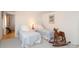 Cozy bedroom featuring twin beds, classic wicker furniture, and a rocking horse at 17333 Saranita Ln, Charlotte, NC 28278