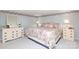 Charming bedroom with floral wallpaper, dresser and a comfortable floral-patterned bed at 17333 Saranita Ln, Charlotte, NC 28278