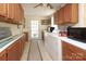 Well-equipped laundry room with ample cabinet space and modern washer and dryer at 17333 Saranita Ln, Charlotte, NC 28278