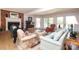 Bright living room with fireplace, hardwood floors, and french doors leading to outdoor space at 17333 Saranita Ln, Charlotte, NC 28278