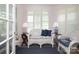 Cozy sitting room featuring neutral colors, shuttered windows, and comfortable seating at 17333 Saranita Ln, Charlotte, NC 28278