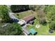 Aerial view of property showcasing the home, yard, deck, outbuildings, carport and firepit at 2003 Cape Hickory Cutoff Rd, Hickory, NC 28601