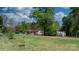 Expansive backyard with well-maintained lawn and mature trees at 2003 Cape Hickory Cutoff Rd, Hickory, NC 28601