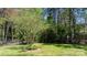 Fenced backyard with lush greenery and ample space at 2003 Cape Hickory Cutoff Rd, Hickory, NC 28601