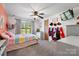 Colorful bedroom with a playful design, a soft bed, ceiling fan and fun decor at 2003 Cape Hickory Cutoff Rd, Hickory, NC 28601