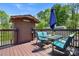 Outdoor deck area featuring a table, umbrella, and seating at 2003 Cape Hickory Cutoff Rd, Hickory, NC 28601