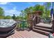 Back deck with grill, table, chairs, and stairs to the lawn at 2003 Cape Hickory Cutoff Rd, Hickory, NC 28601