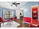 Bright dining area with a retro-style table set, complemented by wood floors and ample lighting at 2003 Cape Hickory Cutoff Rd, Hickory, NC 28601