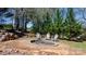Picturesque fire pit surrounded by trees and seating provides an inviting outdoor space at 2003 Cape Hickory Cutoff Rd, Hickory, NC 28601