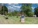 Landscaped front yard with mature trees and well at 2003 Cape Hickory Cutoff Rd, Hickory, NC 28601