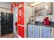 This unique kitchen features a vintage coca-cola theme and a modern stainless steel refrigerator at 2003 Cape Hickory Cutoff Rd, Hickory, NC 28601