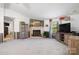 Cozy living room with stone fireplace, wood furnishings, and a large window at 2003 Cape Hickory Cutoff Rd, Hickory, NC 28601