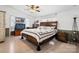 Spacious main bedroom with a ceiling fan, and large windows and a comfortable king-sized bed at 2003 Cape Hickory Cutoff Rd, Hickory, NC 28601