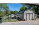 Durable metal shed and boat under carport with a fenced yard at 2003 Cape Hickory Cutoff Rd, Hickory, NC 28601