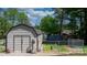 Durable metal storage building provides secure space for tools and equipment in backyard at 2003 Cape Hickory Cutoff Rd, Hickory, NC 28601