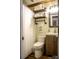 Cozy bathroom with rustic accents, wood-look flooring, and charming details at 201 S Hoskins Rd # 132, Charlotte, NC 28208