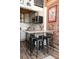 Charming kitchen with gray cabinets, granite countertops, and breakfast bar at 201 S Hoskins Rd # 132, Charlotte, NC 28208