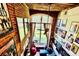 High-angle view of living room with exposed brick walls, large window, and decor at 201 S Hoskins Rd # 132, Charlotte, NC 28208