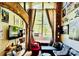 Inviting living room featuring exposed brick, large window, and stylish decor at 201 S Hoskins Rd # 132, Charlotte, NC 28208