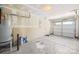 Spacious unfinished garage featuring a water heater, new garage door, and ample storage space at 2115 Sonoma Valley Dr, Charlotte, NC 28214