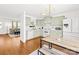 Bright eat-in kitchen showcases recessed lighting, light green cabinets, white appliances and an open layout at 2115 Sonoma Valley Dr, Charlotte, NC 28214