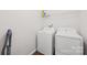 Functional laundry room with washer, dryer, utility shelving, and ample space for laundry tasks at 2115 Sonoma Valley Dr, Charlotte, NC 28214