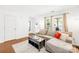 Bright living room featuring a comfortable sectional sofa, stylish decor, and natural light from large windows at 2115 Sonoma Valley Dr, Charlotte, NC 28214