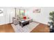 Bright living room featuring a comfortable sectional sofa, stylish decor, and natural light from large windows at 2115 Sonoma Valley Dr, Charlotte, NC 28214