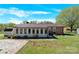 A large backyard with an attached back room and a brick house at 2116 1St Avenue Nw Pl, Hickory, NC 28601