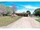 Lovely brick home with a carport, long driveway, and mature trees, offering a comfortable and inviting atmosphere at 2116 1St Avenue Nw Pl, Hickory, NC 28601