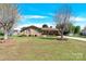 Traditional brick home featuring a well-manicured lawn and mature trees, enhancing its curb appeal at 2116 1St Avenue Nw Pl, Hickory, NC 28601