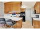 Functional kitchen with white countertops, black appliances, and vintage wood cabinetry, perfect for cooking at 2116 1St Avenue Nw Pl, Hickory, NC 28601