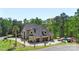 Aerial view of an estate featuring a circular driveway, three car garage, and pool at 220 Palm Cove Way, York, SC 29745