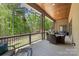 The covered back porch offers an outdoor dining and relaxing space overlooking the backyard at 220 Palm Cove Way, York, SC 29745
