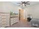 This bedroom has neutral walls and carpet, ceiling fan, and access to the ensuite bathroom at 220 Palm Cove Way, York, SC 29745