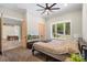 Spacious bedroom with large windows, ceiling fan, carpet, and view into the office space at 220 Palm Cove Way, York, SC 29745