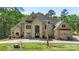 Stunning two-story stucco home featuring a spacious front yard and well-manicured landscaping at 220 Palm Cove Way, York, SC 29745
