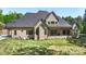 Expansive home exterior featuring a covered porch and well-maintained lawn at 220 Palm Cove Way, York, SC 29745