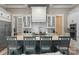 Modern kitchen with a large center island, stainless steel appliances, and custom cabinetry at 220 Palm Cove Way, York, SC 29745