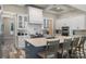 Well-appointed kitchen featuring a center island, subway tile backsplash, and stainless steel appliances at 220 Palm Cove Way, York, SC 29745
