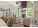 Bright living room features a fireplace, hardwood floors, and large windows with scenic outdoor views at 220 Palm Cove Way, York, SC 29745