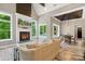 Open-concept living area boasts a fireplace, hardwood floors, and access to the dining room at 220 Palm Cove Way, York, SC 29745