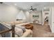 Upper level loft sitting area with plush sofa and television at 220 Palm Cove Way, York, SC 29745