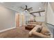 Open loft sitting area with beams and a plush sofa at 220 Palm Cove Way, York, SC 29745