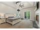 Spacious main bedroom featuring vaulted ceiling, fireplace, access to private balcony, and ensuite bathroom at 220 Palm Cove Way, York, SC 29745