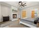 Bright main bedroom with fireplace, TV, ceiling fan and carpet at 220 Palm Cove Way, York, SC 29745