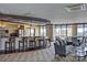The common room provides lounge chairs, tables, chairs and barstool seating, with shared counterspace and city views at 222 S Caldwell St # 1801, Charlotte, NC 28202