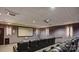 Private theater room with comfortable seating and a large screen for immersive entertainment at 222 S Caldwell St # 1801, Charlotte, NC 28202